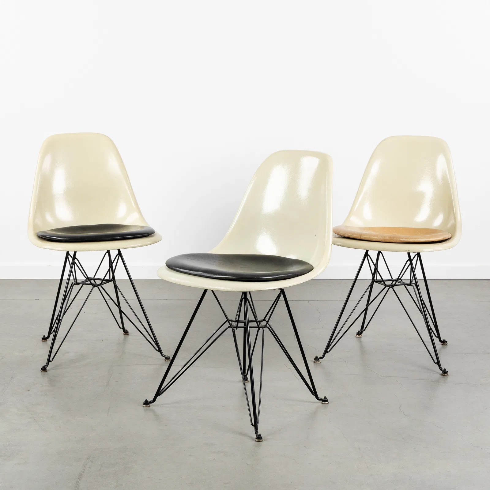 Charles & Ray Eames (XX-XXI) 'Fiberglass Chair DSR', three chairs, for Vitra, circa 1960.