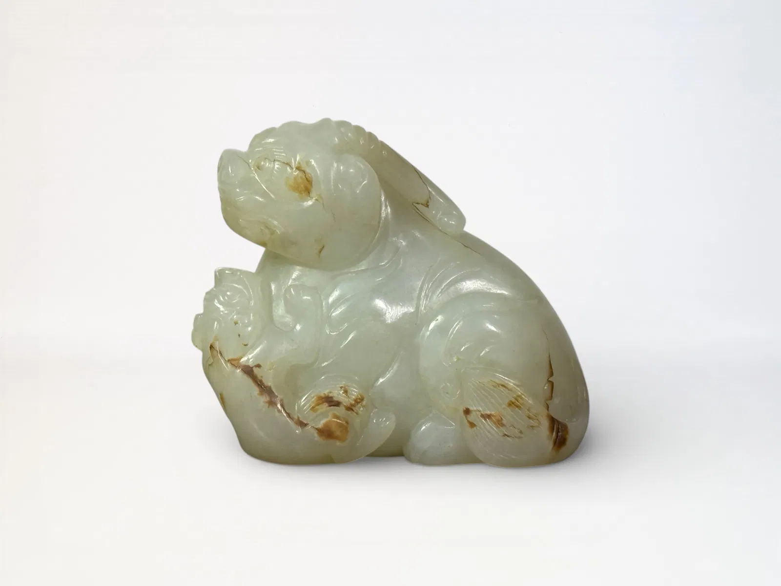 Chinese Carved White and Russet Jade 'Mythical Beast' Group