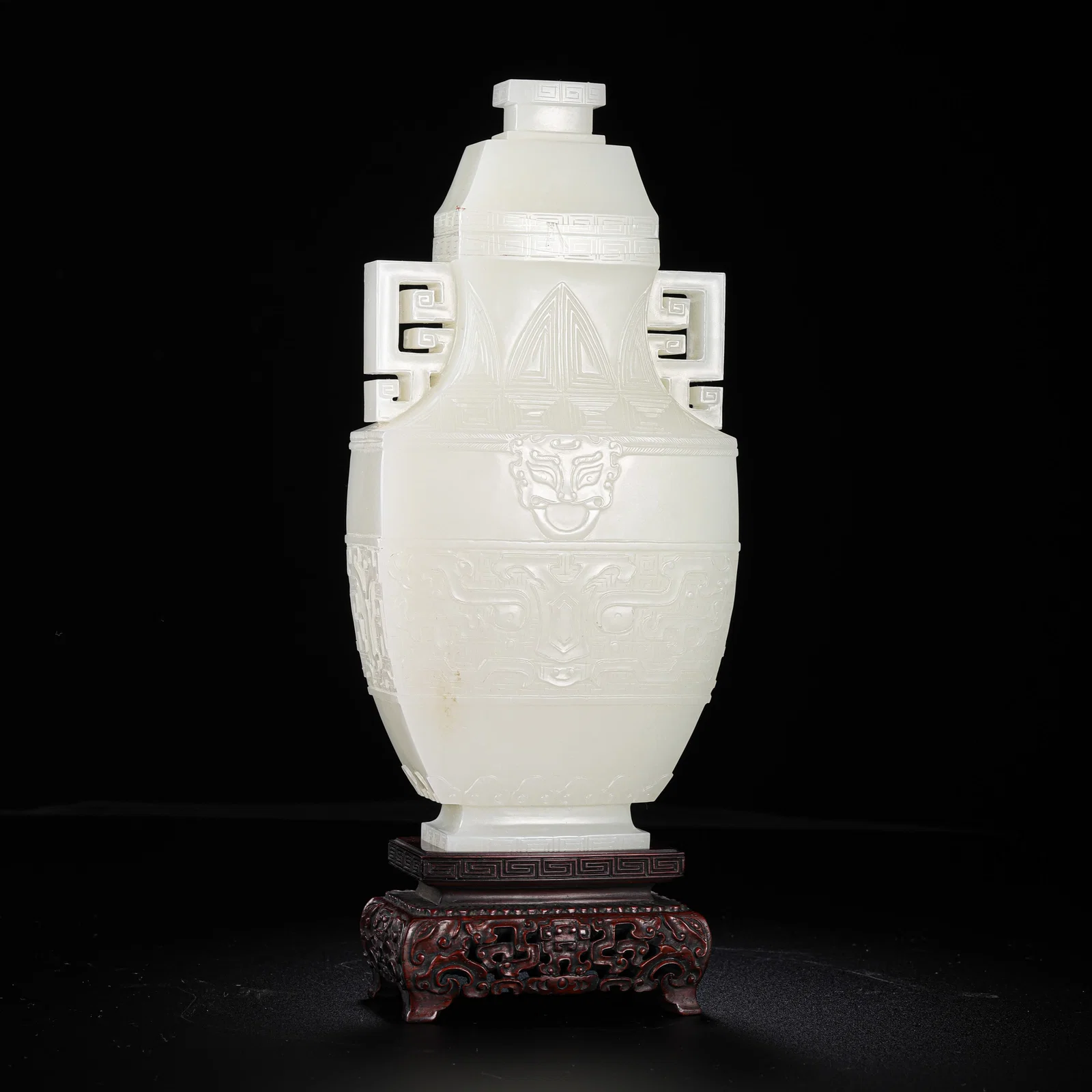 Chinese Qing Dynasty Hetian white jade double-eared covered vase with animal mask design