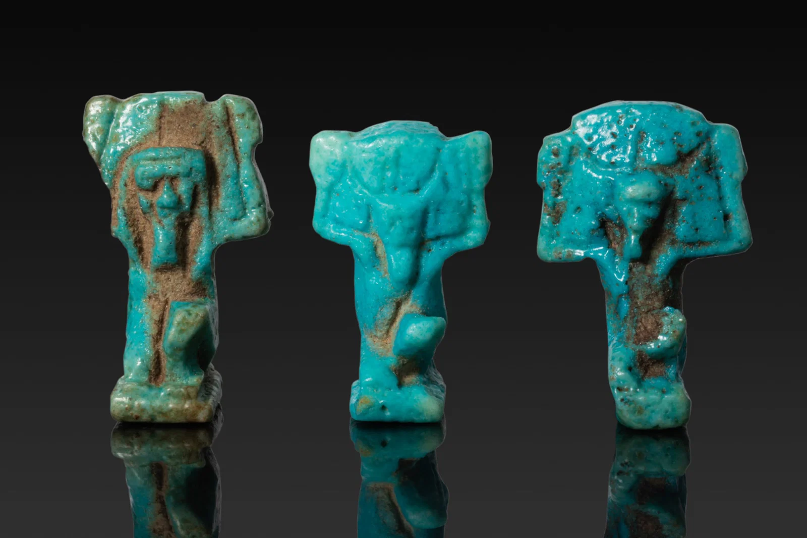COLLECTION OF EGYPTIAN FAIENCE AMULETS OF SHU