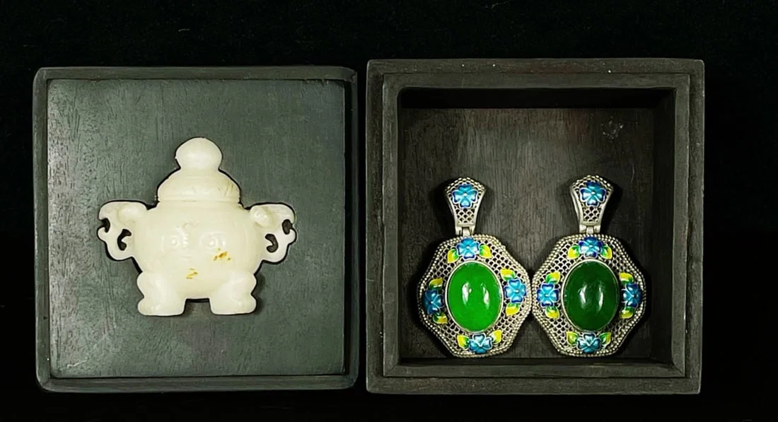 Collector's edition rosewood box containing silver-inlaid jade pendant