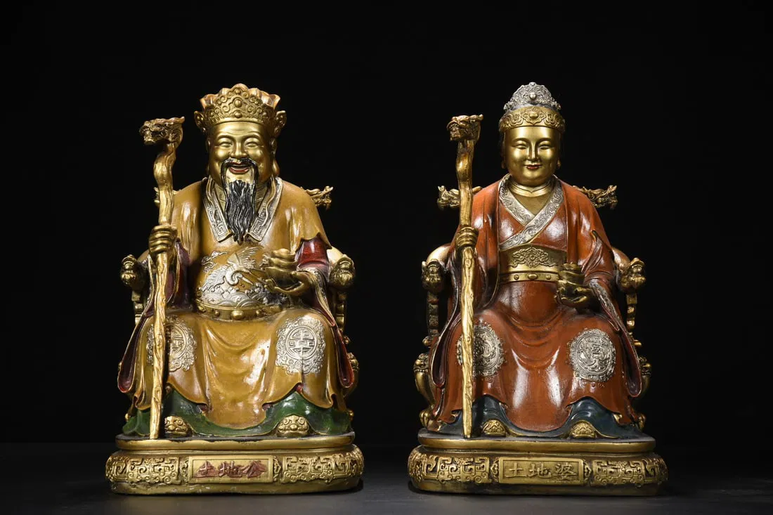 Copper painted statues of the Earth God and Earth Goddess