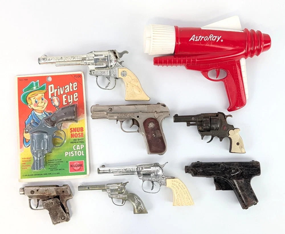 Daisy Superman Krypto Raygun, AstroRay Flashlight, and Lot Of Cap Guns