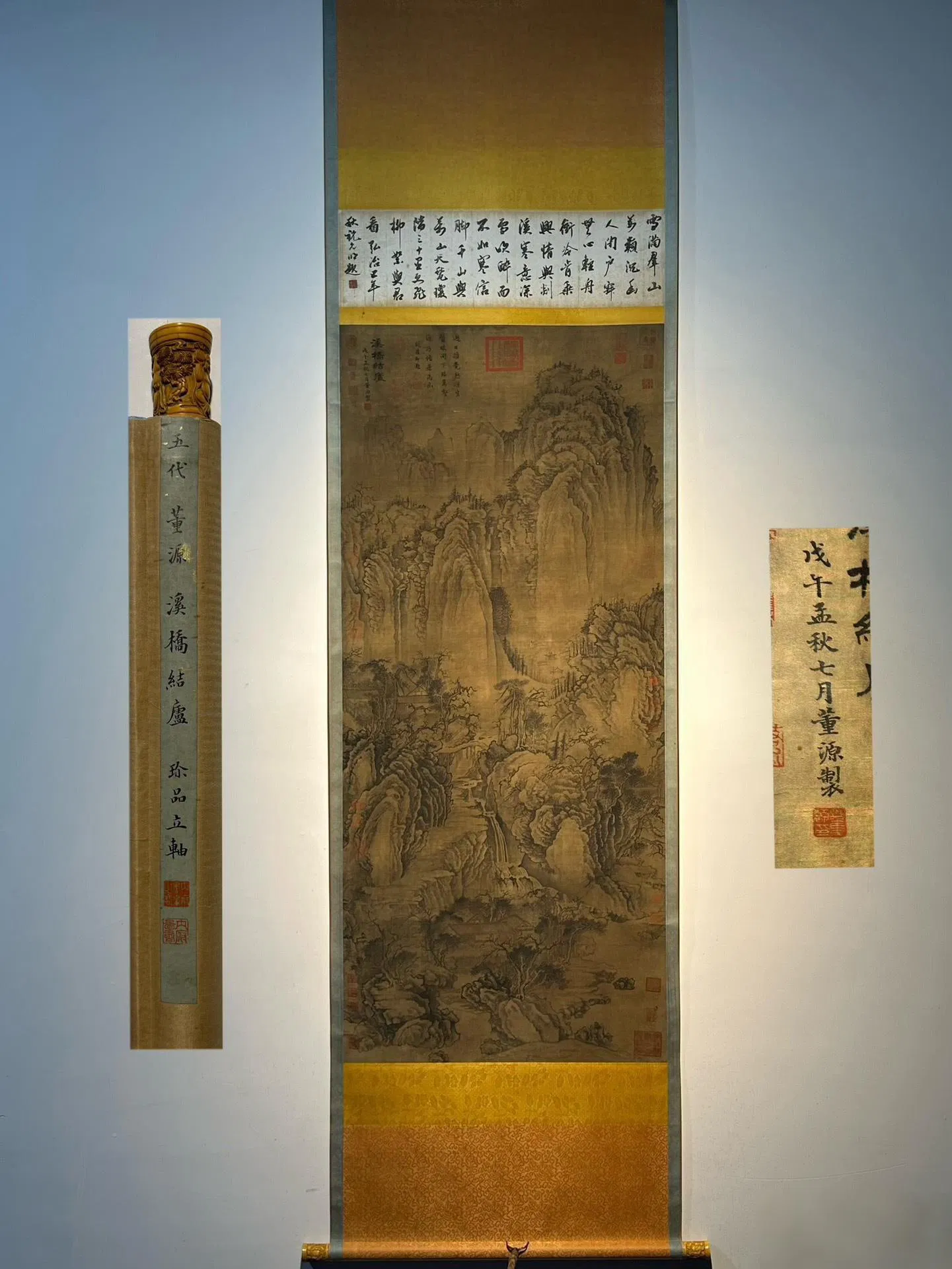 Dong Yuan's exquisite hand-painted ivory scroll on silk (with a bridge and knotted sash design).