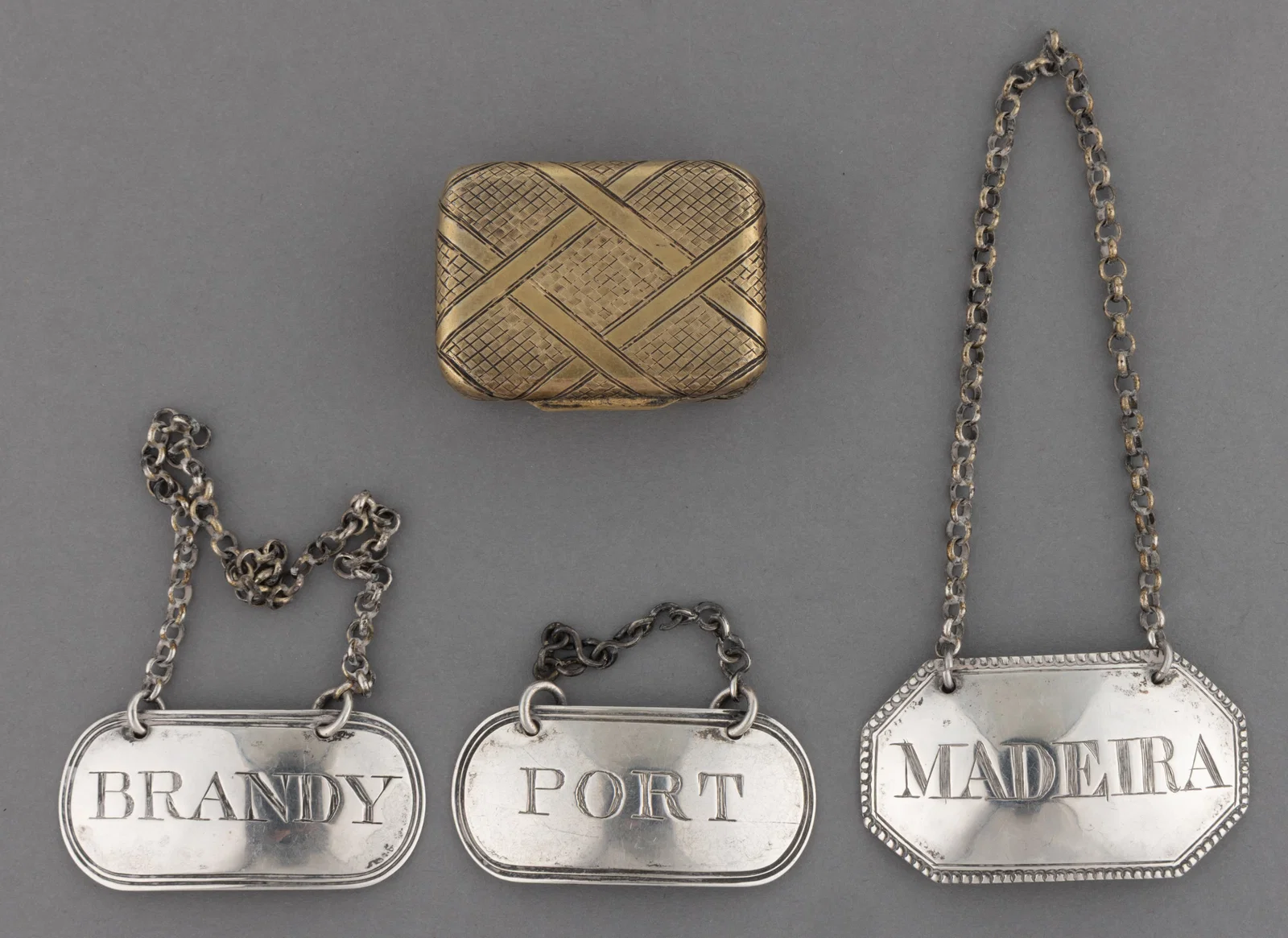 ENGLISH GEORGIAN STERLING SILVER VINAIGRETTE AND BOTTLE TICKETS, LOT OF FOUR