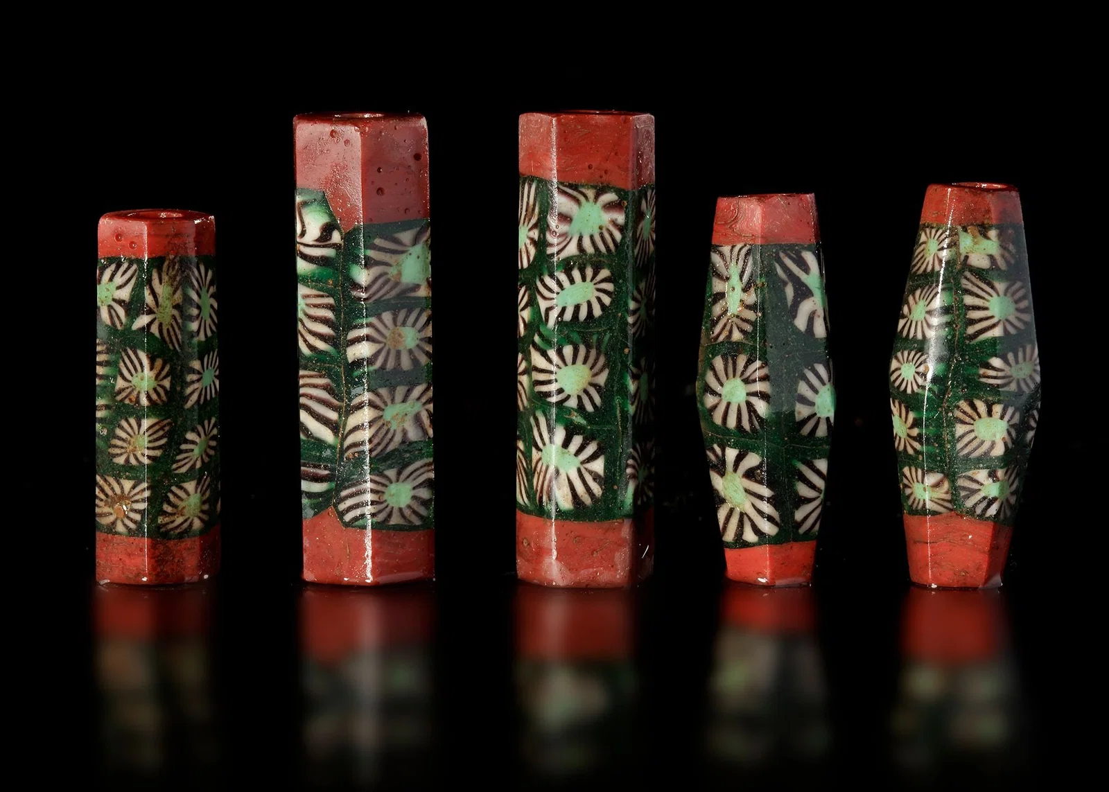 FIVE EARLY ISLAMIC GLASS BEADS SYRIA, 900â€“1200 AD