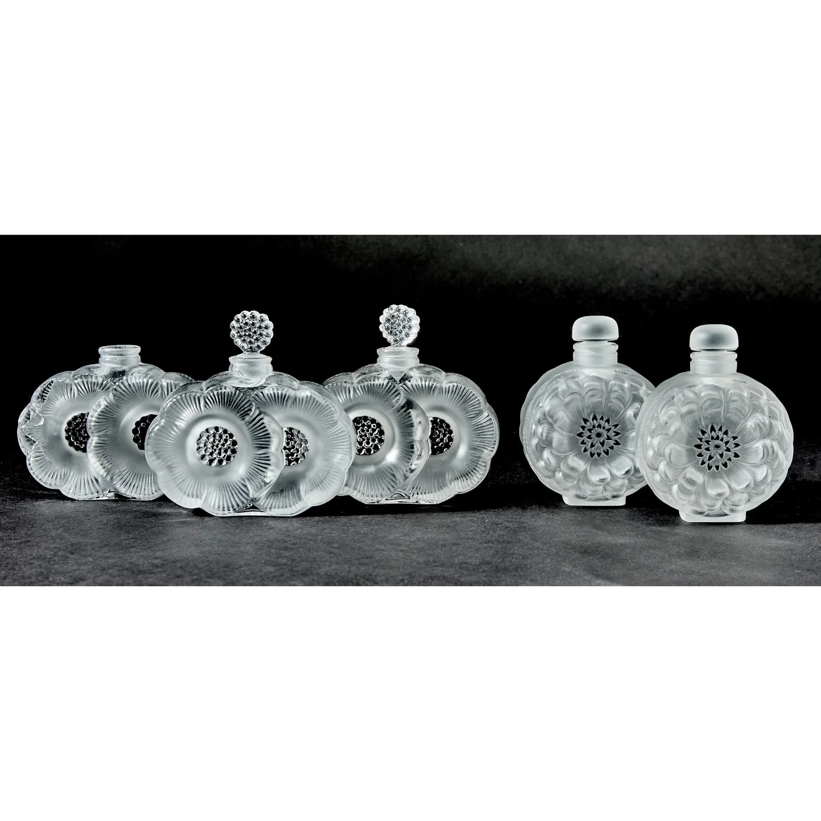 Five Lalique Molded Glass and Enamel Perfume Bottles
