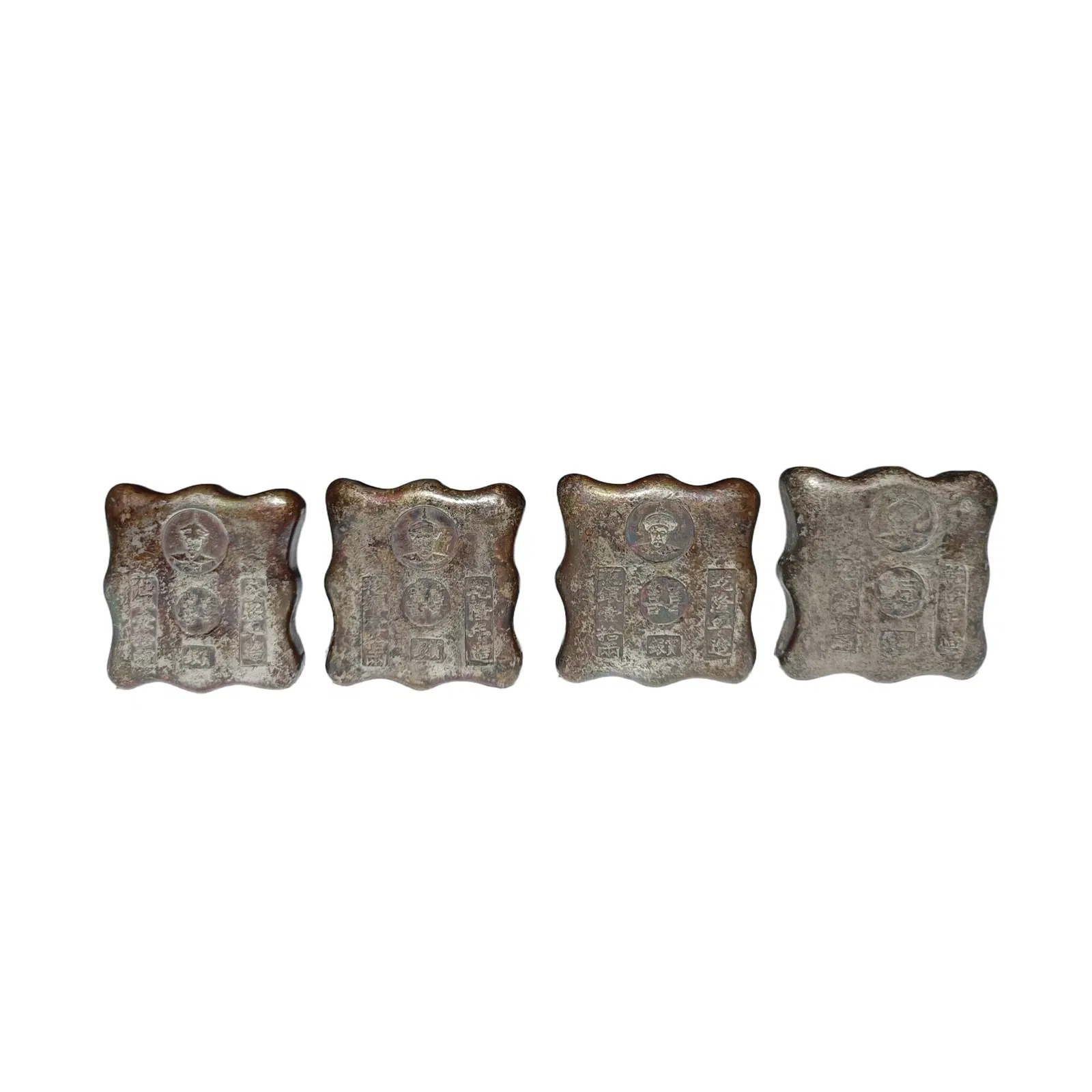 Four silver ingots from the Qing Dynasty, privately owned collection.