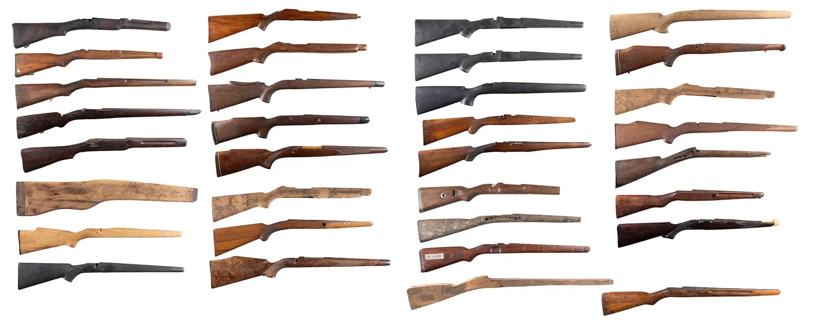 GROUPING OF 32 SPORTING RIFLE STOCKS.