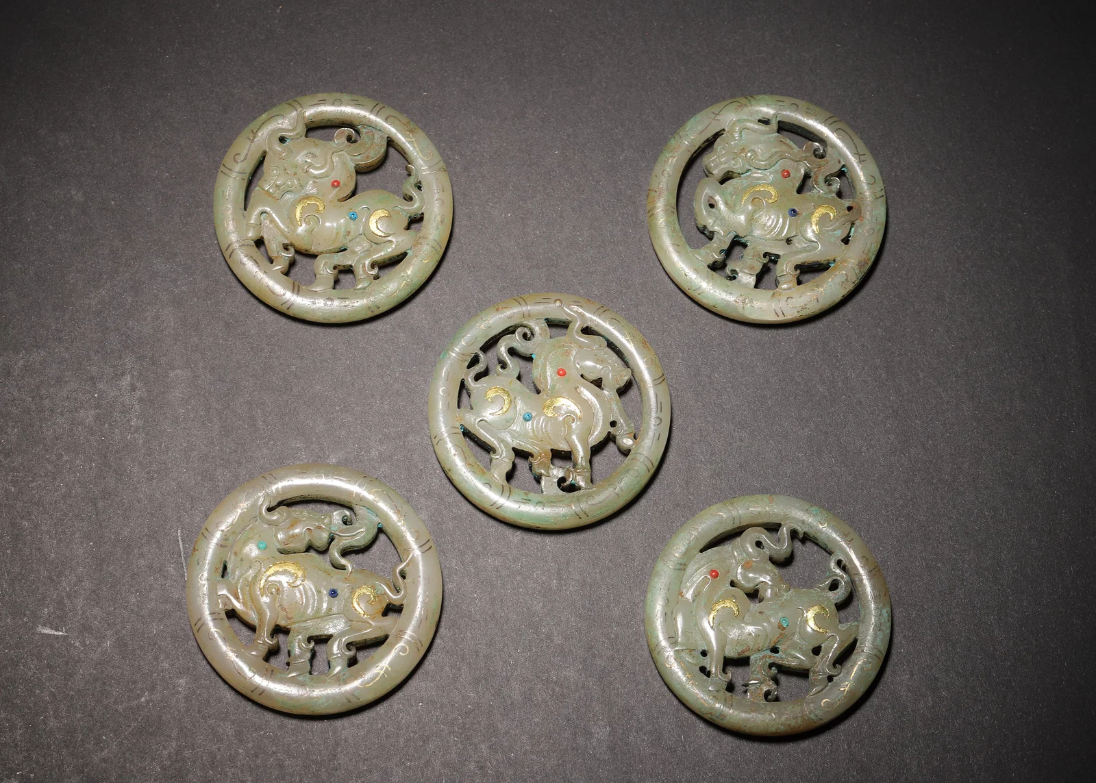 HAN DYNASTY HETIAN JADE OPENWORK RING PENDANTS WITH GOLD INLAY & GEM-SET BEAST MOTIFS (SET OF 5)