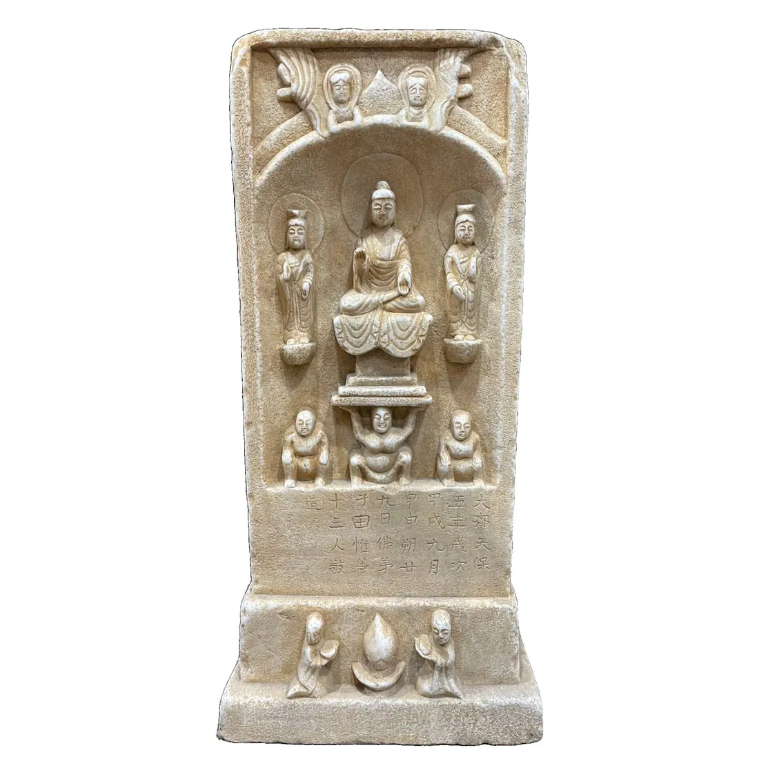 Han white jade intricately carved with one Buddha and two disciples.