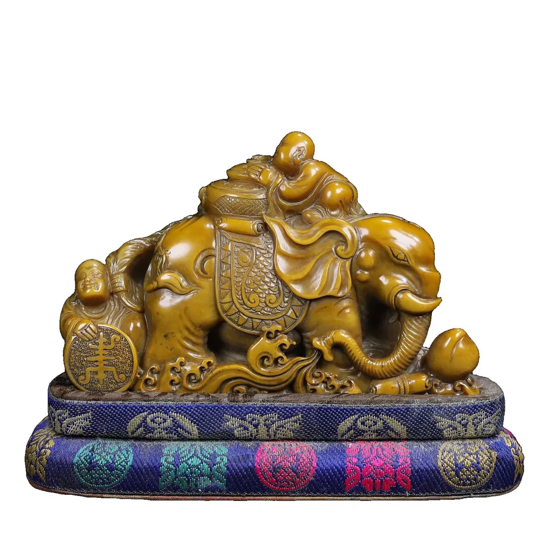 Hand-carved Shoushan stone seal with a boy and an elephant.