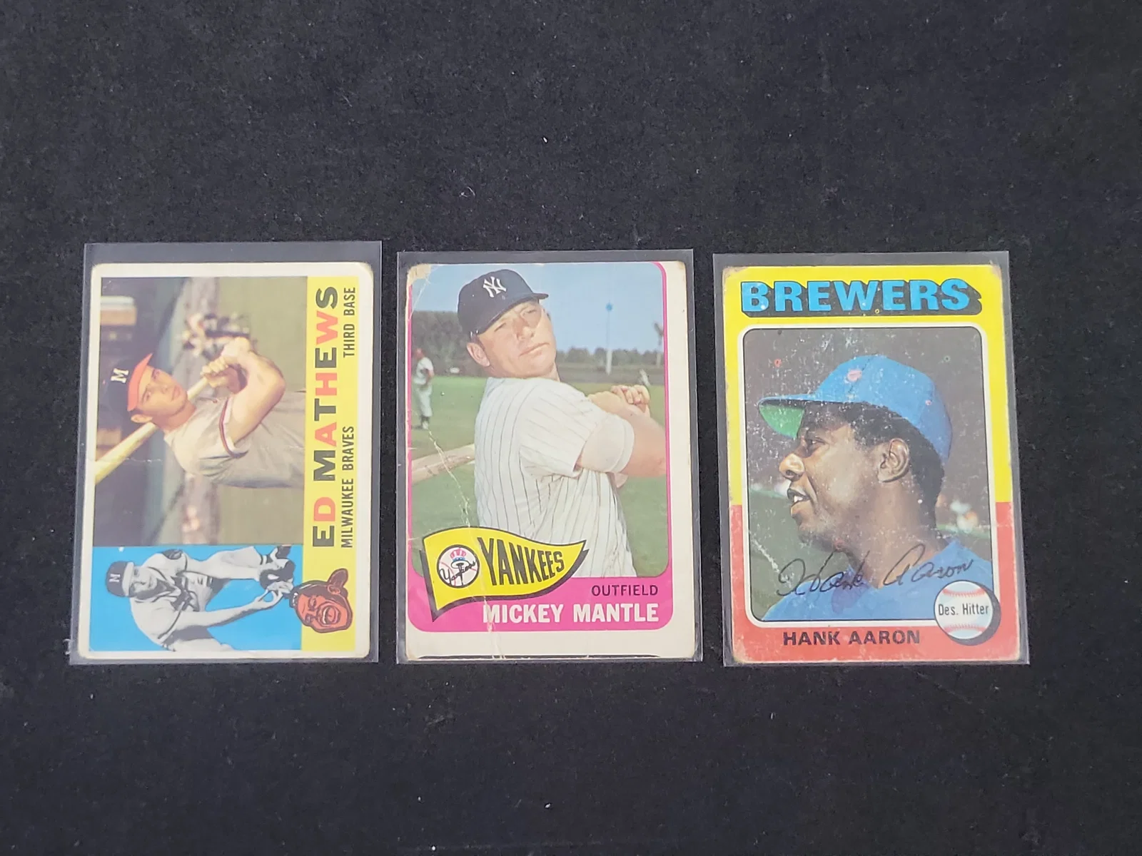 I01416 | A Trio of Vintage Topps Baseball Cards Featuring Mickey Mantle, Hank Aaron, and Ed Mathews