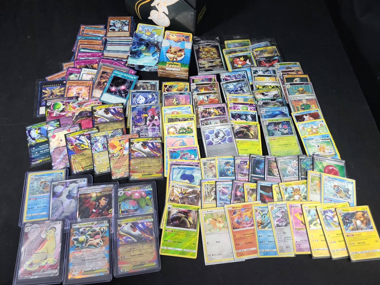 I01833 | An Assortment of Pokemon and Yu-Gi-Oh! Trading Cards with Deck Boxes