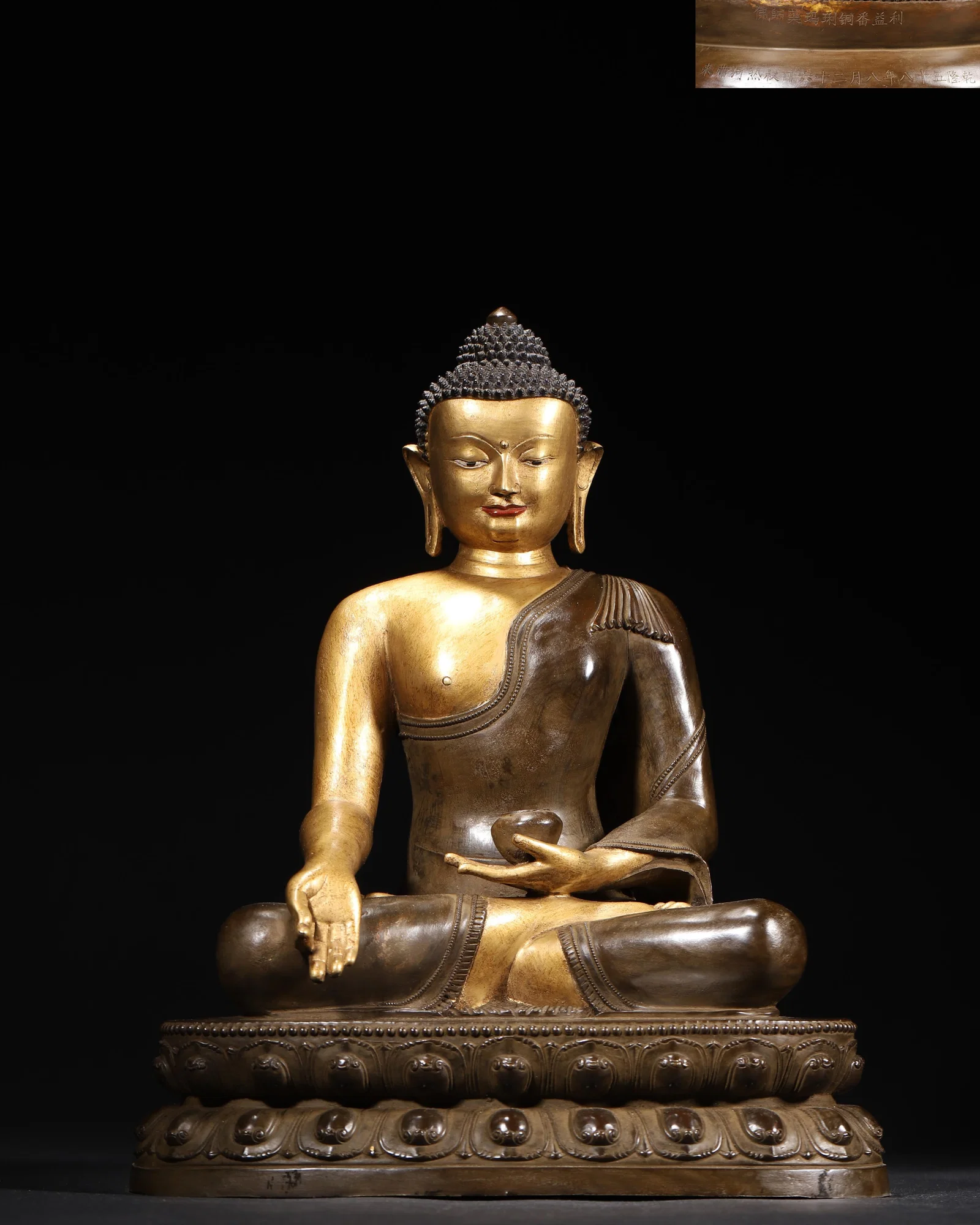 IMPERIAL QIANLONG PERIOD, QING DYNASTY GILT-BRONZE SEATED STATUE OF MEDICINE BUDDHA (WITH QIANLONG