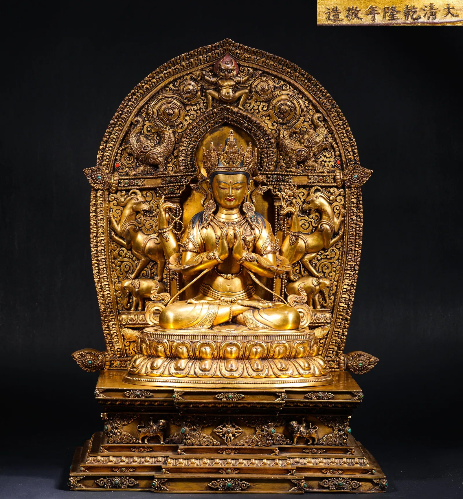 IN THE REIGN OF EMPEROR QIANLONG OF THE QING DYNASTY, A GILDED BRONZE STATUE OF GUANYIN WITH FOUR