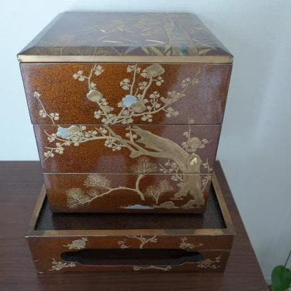 Lacquered Bento Box, decorated with floral and bird motifs, gold leaf embellishments, antique wooden