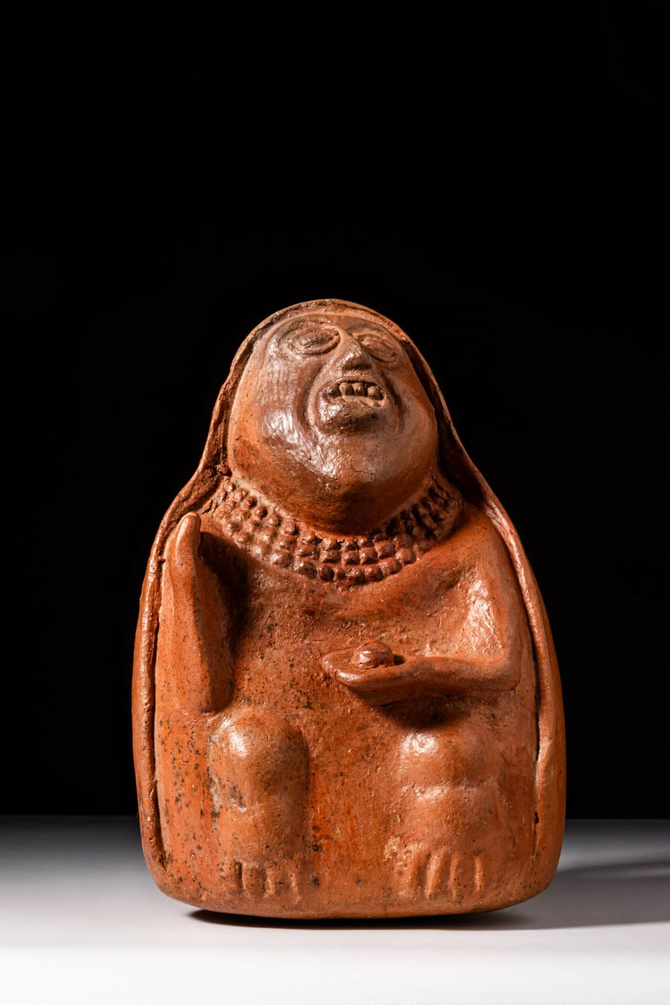LAMBAYEQUE STYLE STIRRUP VESSEL DEPICTING A FEMALE HEALER WITH CACTUS