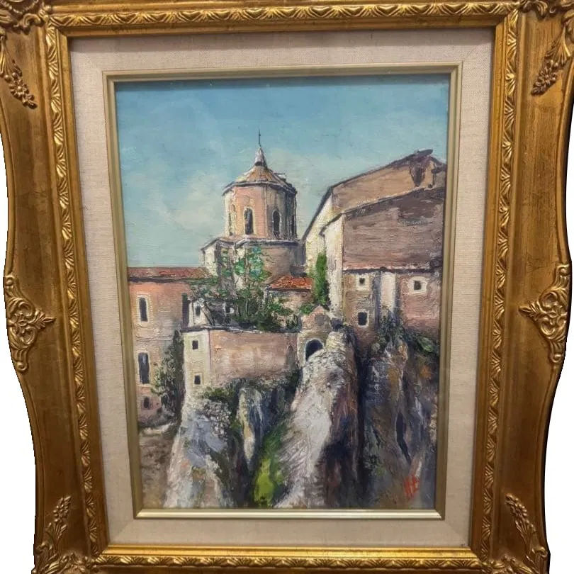 Landscape oil painting with a gold decorative frame.