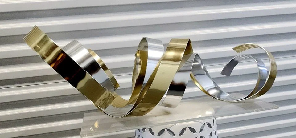 Large epic 40"w MCM Dan Murphy ribbon metal sculpture on clear luciite base. A collector level work.