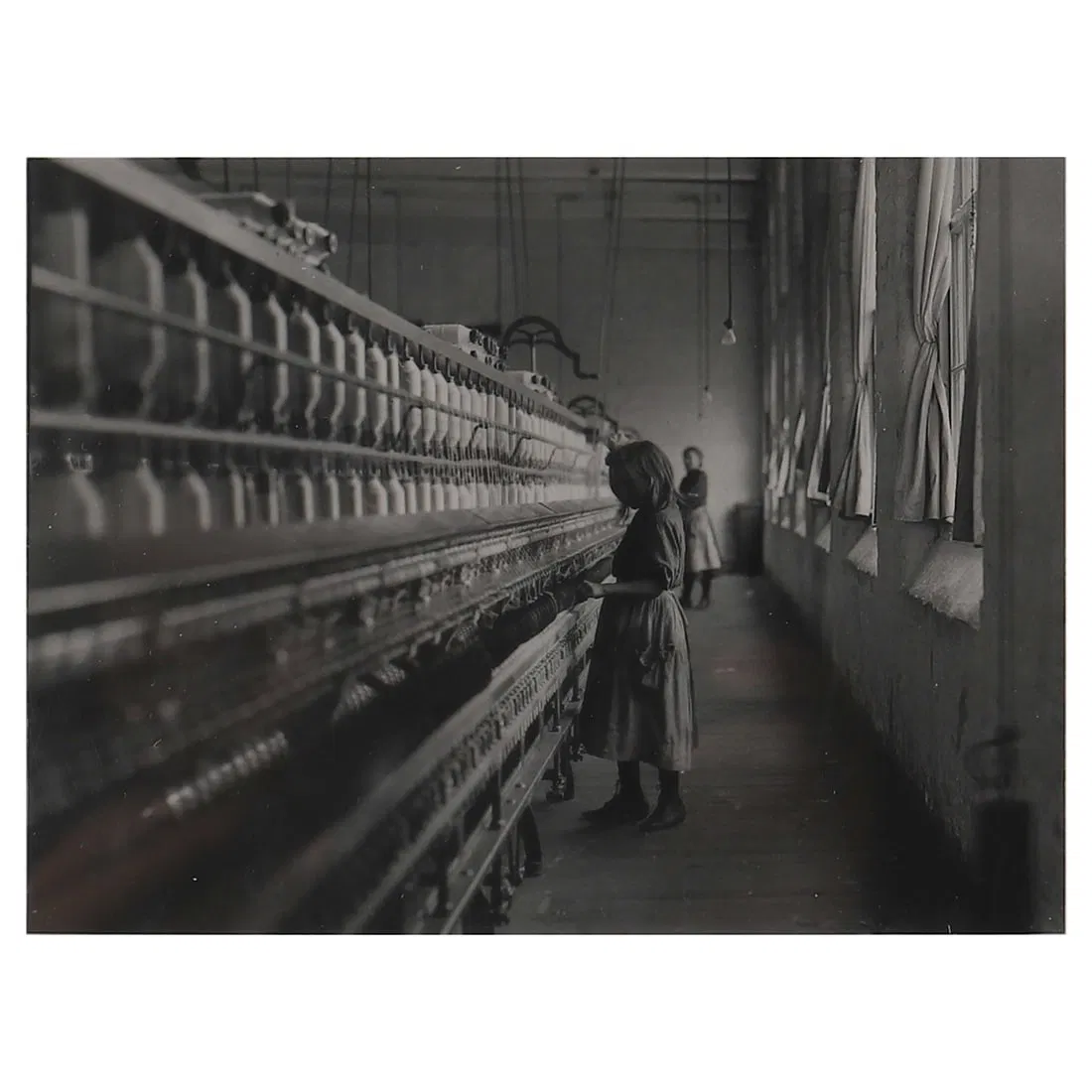 LEWIS WICKES HINE (1874–1940) GIRL WORKING IN A CAROLINA COTTON MILL