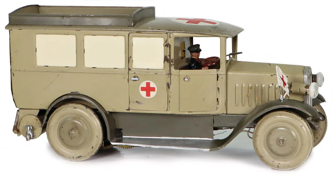 LINEOL ambulance, tin, lithographed, age-related paintwork damages, one flag is missing, right wheel