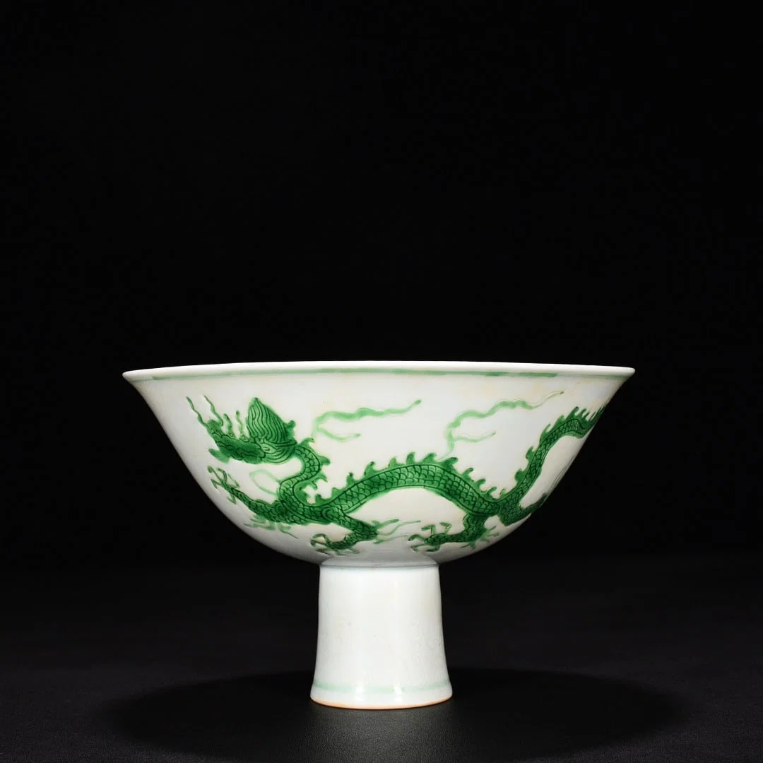 Ming Dynasty Chenghua green glaze dark engraved cloud and dragon tall bowl