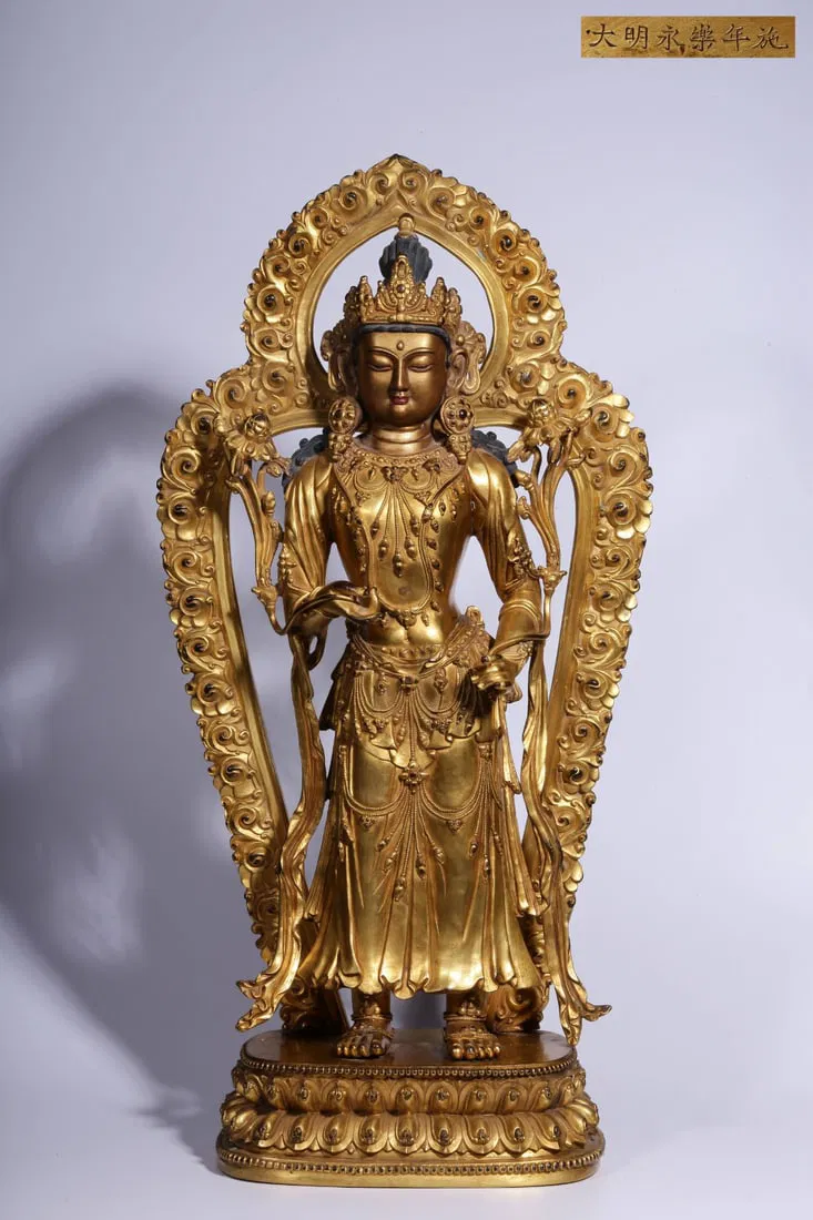MING DYNASTY GILT BRONZE GUANYIN HOLDING LOTUS