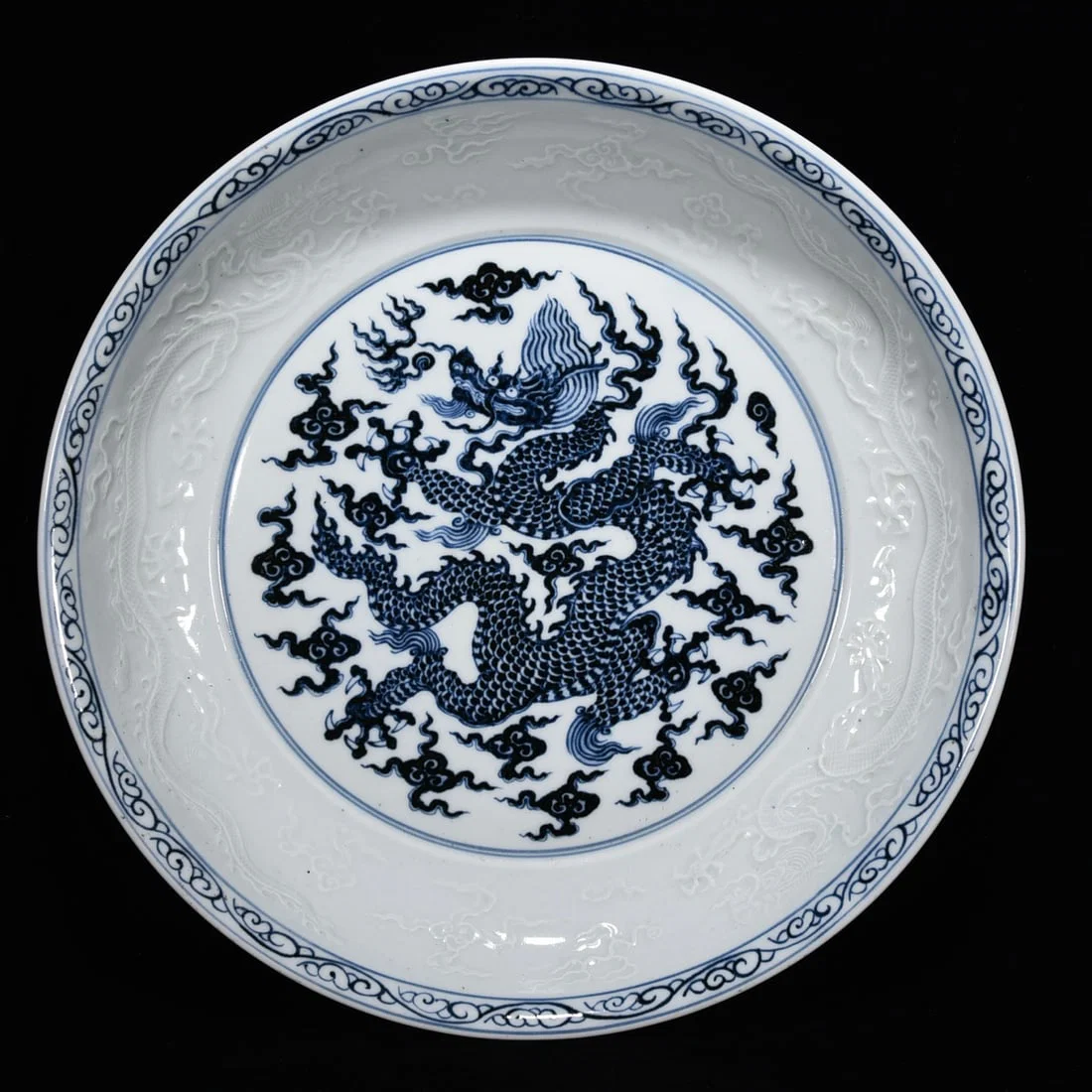 Ming Dynasty Xuande blue and white relief dragon porcelain plate