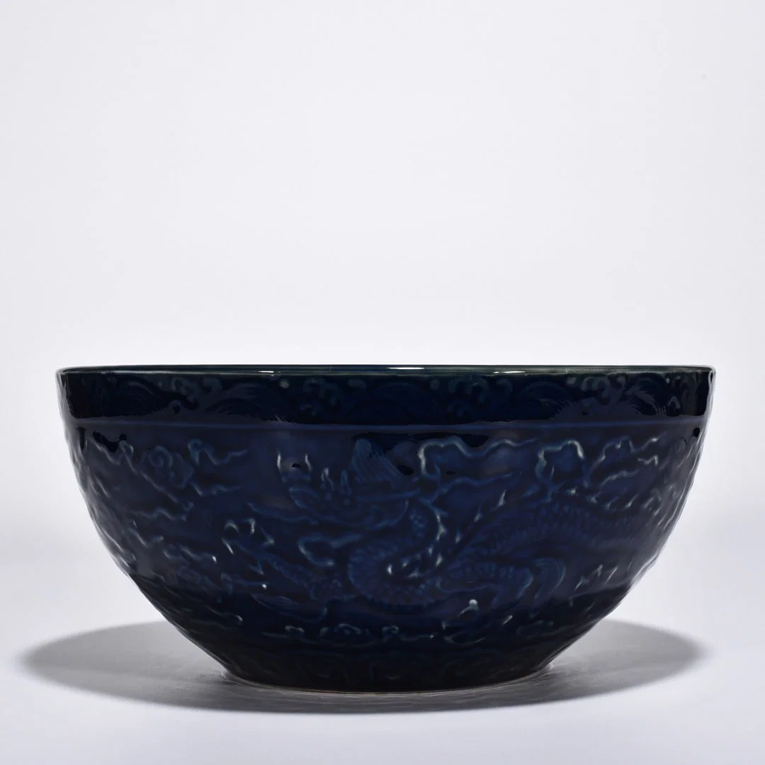 Ming Dynasty Xuande blue-glazed carved cloud and dragon bowl