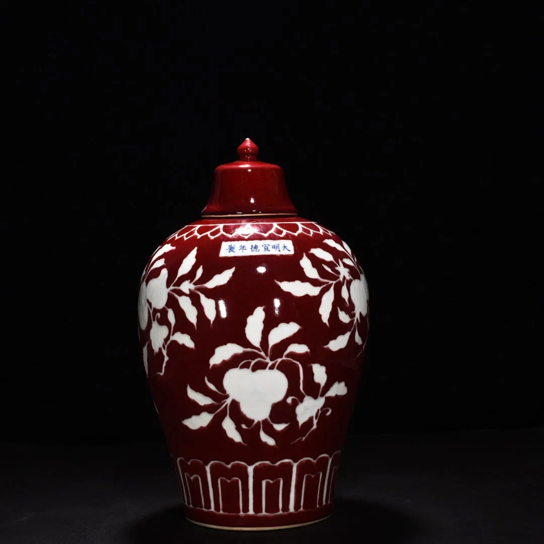 Ming Dynasty Xuande gem-glazed white engraved branch, flower and fruit plum vase