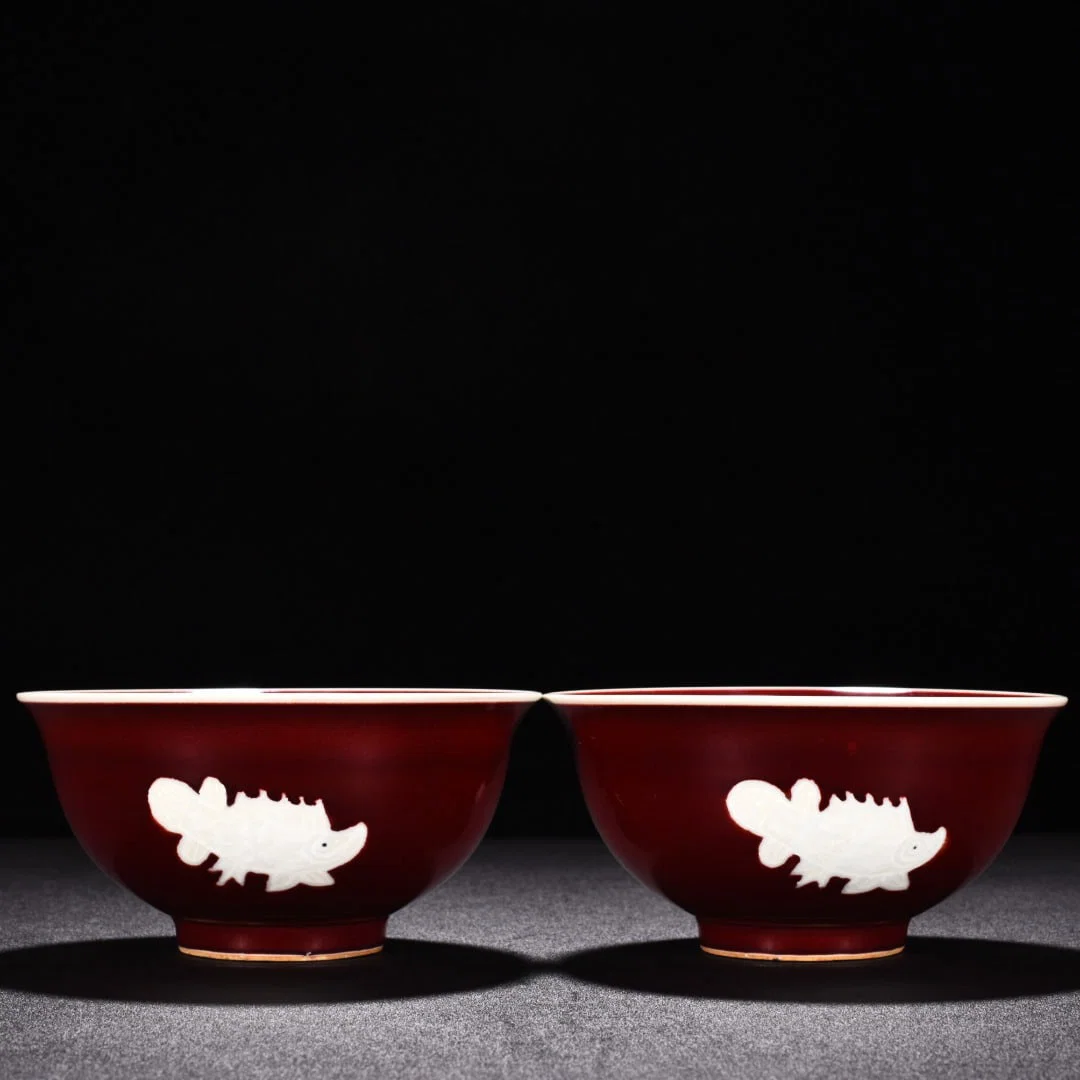 Ming Dynasty Xuande ruby red glaze pile-engraved three-fish bowl