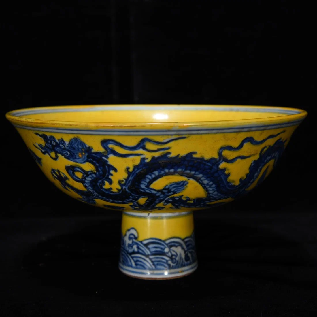 Ming Dynasty Xuande yellow ground blue and white dragon and phoenix tall bowl