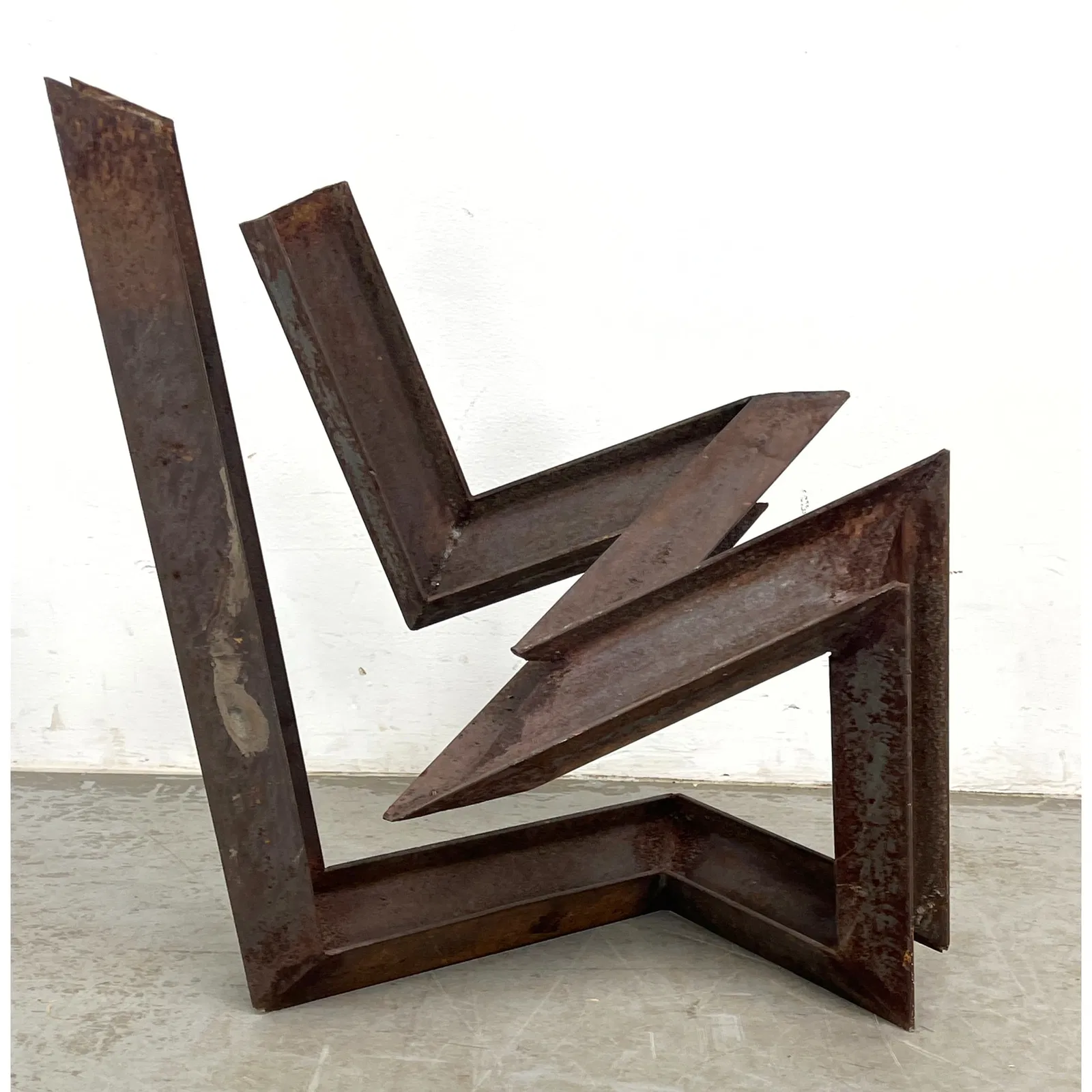 Modernist Abstract Modern Steel Garden Sculpture. The interlocking form creates a dynamic architectu