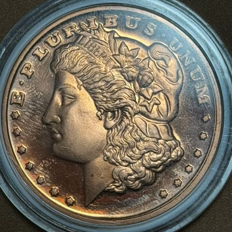 Morgan silver dollar coin, 1 ounce copper.