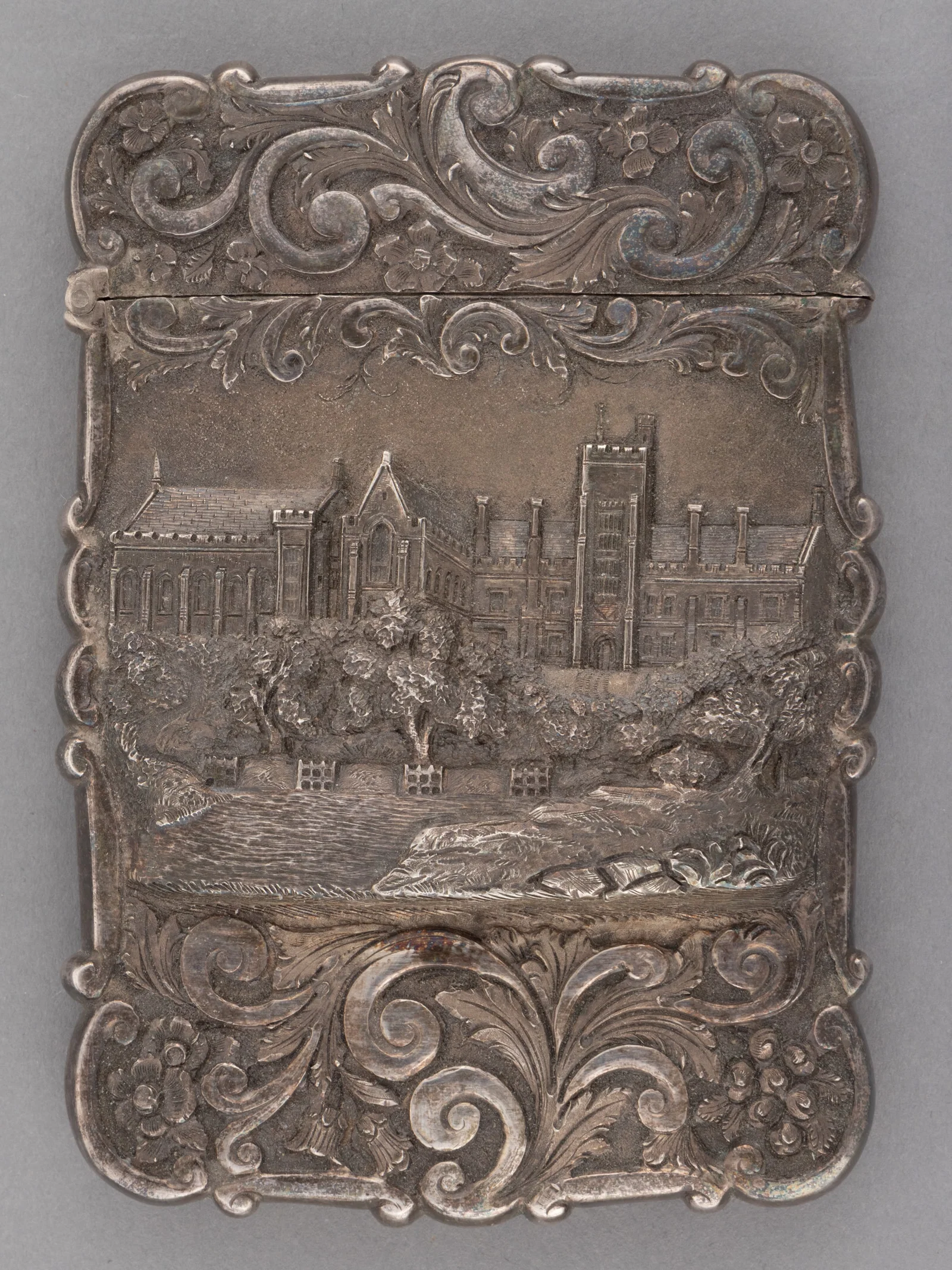 NATHANIEL MILLS, ENGLISH VICTORIAN REPOUSSE STERLING SILVER CASTLE-TOP CARD CASE