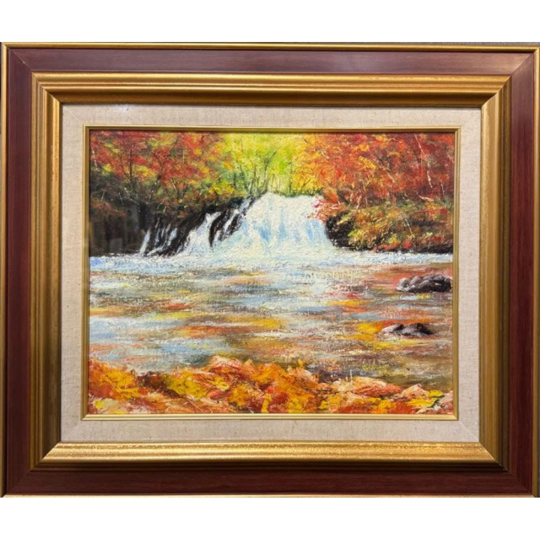 Oil painting of an autumn waterfall scene, with a gilt frame.
