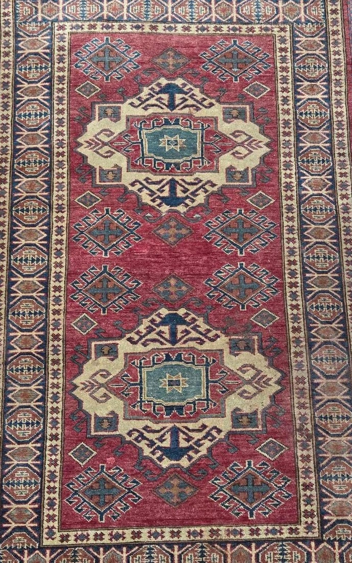 ORIENTAL WOOL RUG WITH DOUBLE MEDALLION