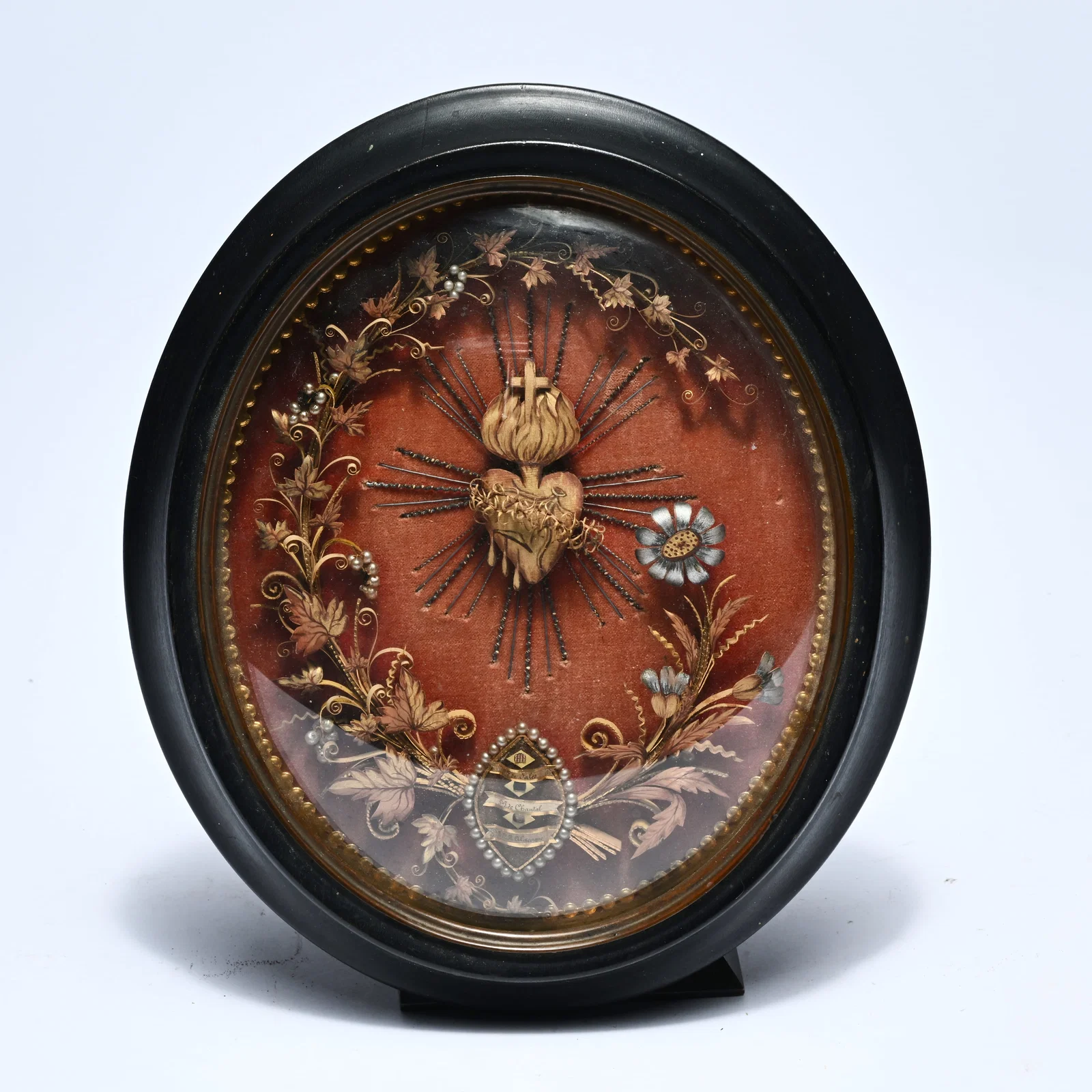 Oval reliquary with a depiction of the Sacred Heart and 3 relics