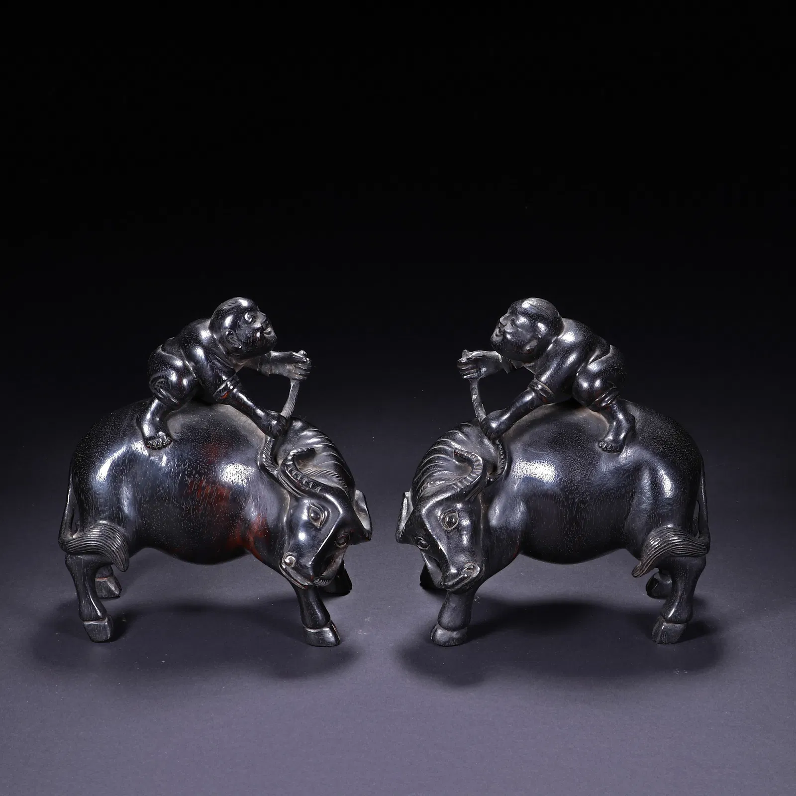 PAIR CARVED ROSEWOOD ZITAN BOY ON BUFFALOS