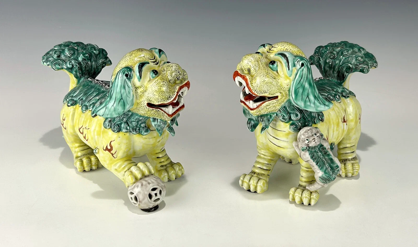 PAIR OF ANTIQUE CHINESE 19TH CENTURY SANCAI GLAZED PORCELAIN FOO DOGS