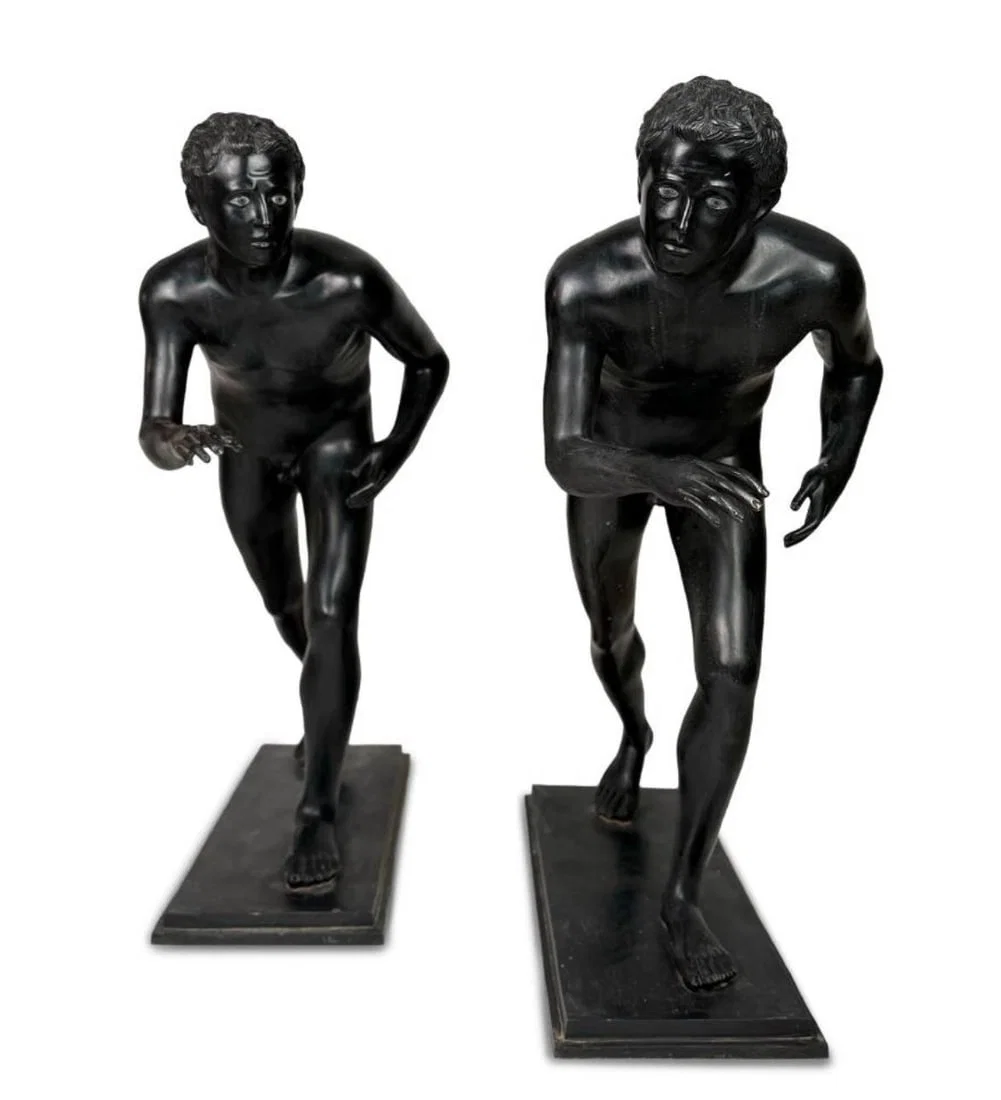Pair of bronze runners from Pompeii, based on originals from the 1st century BC.