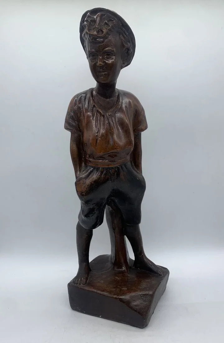 porcelain boy with hat