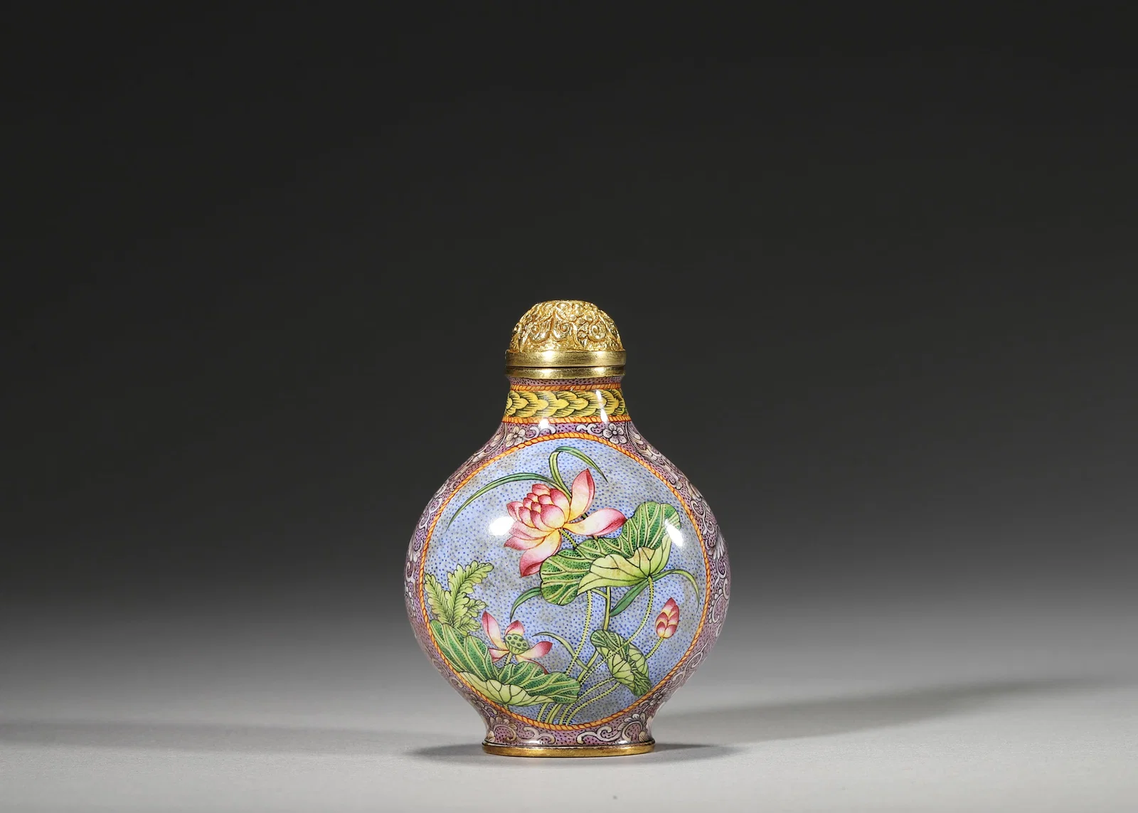 QIANLONG PERIOD, QING DYNASTY COPPER-BODIED ENAMEL SNUFF BOTTLE WITH FLORAL MEDALLIONS