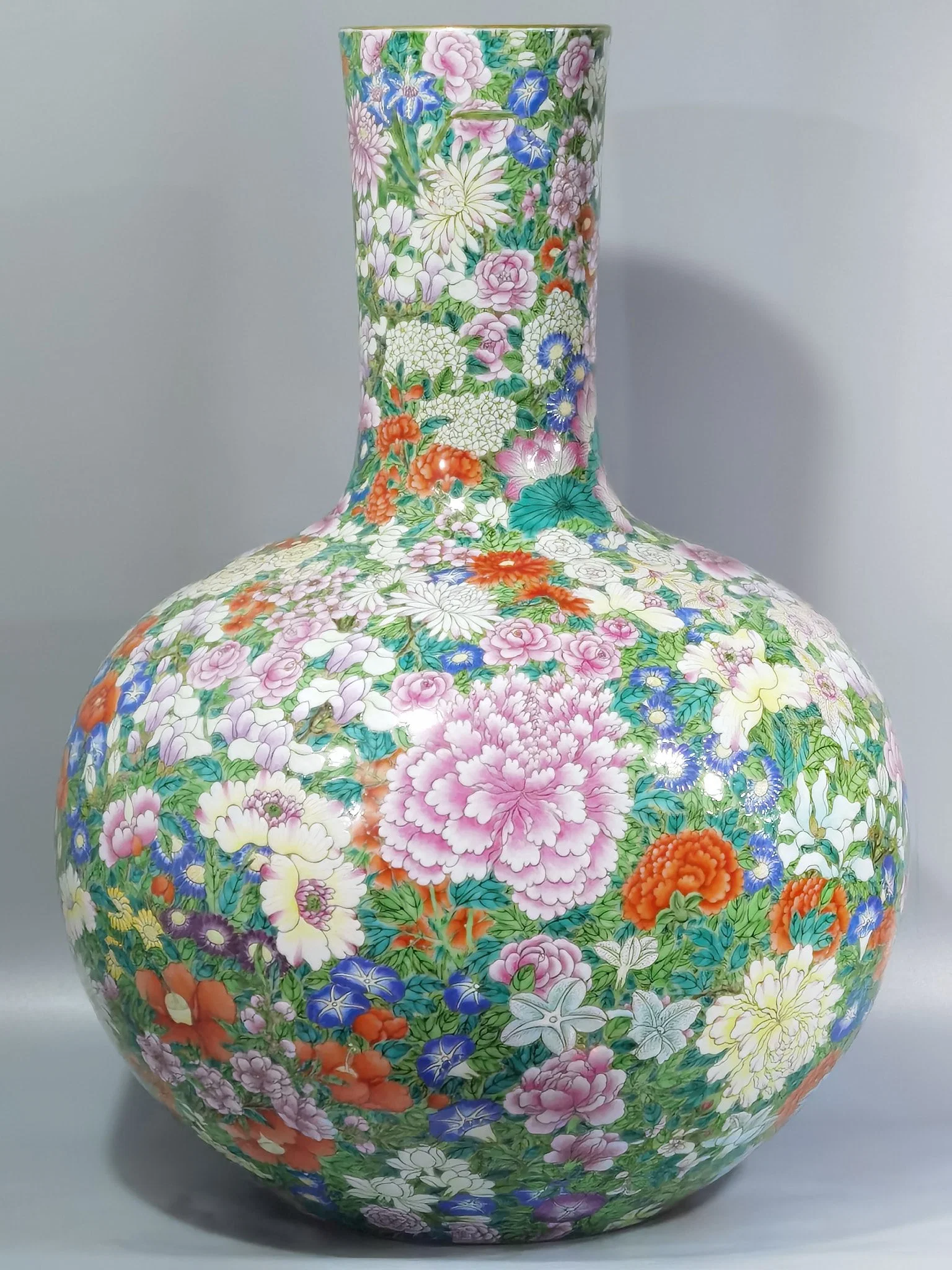 Qianlong period Qing Dynasty pastel colored celestial hundreds of flowers vase