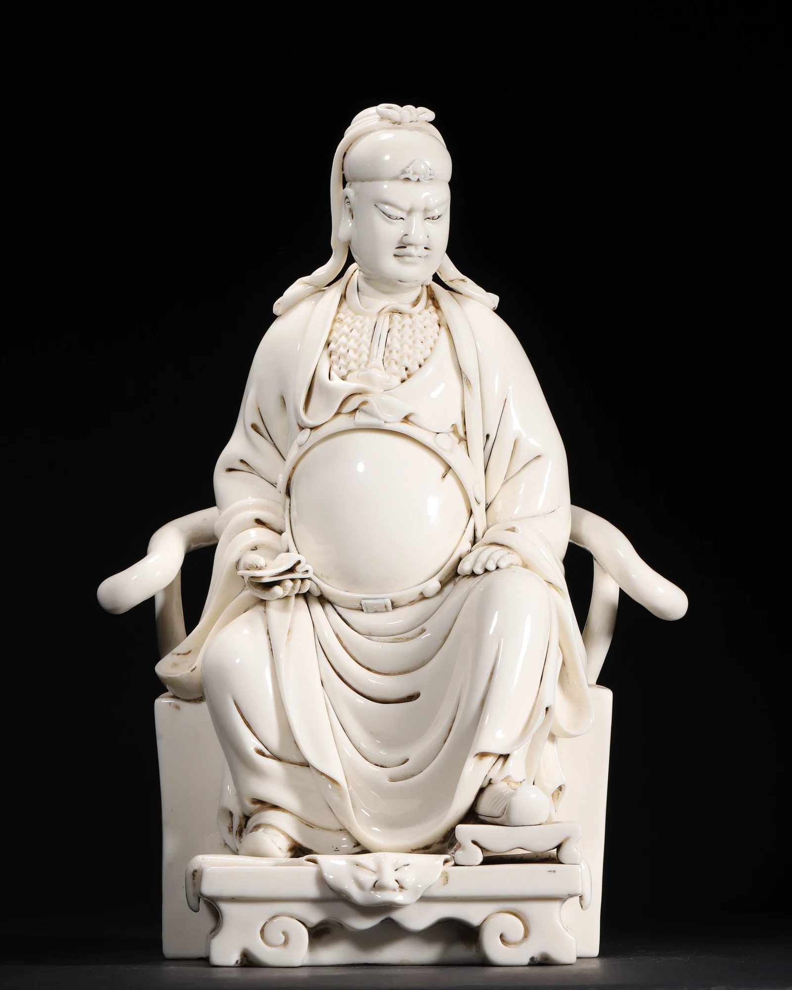 QING DYNASTY, A DEHUA WHITE-GLAZED SEATED FIGURE OF WENCHANG DIJUN, WITH SEAL MARK
