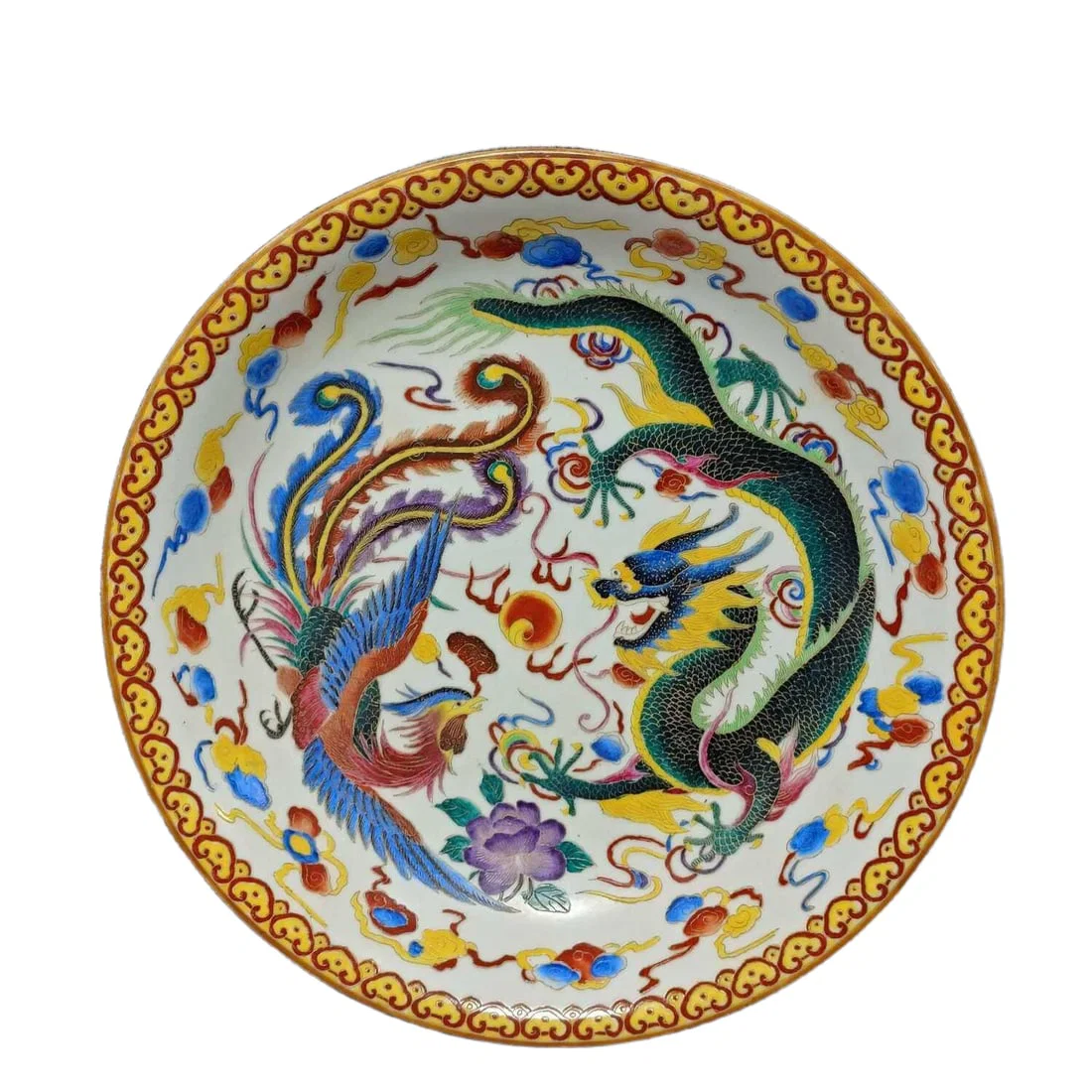 Qing Dynasty cloisonne plate with dragon and phoenix design.