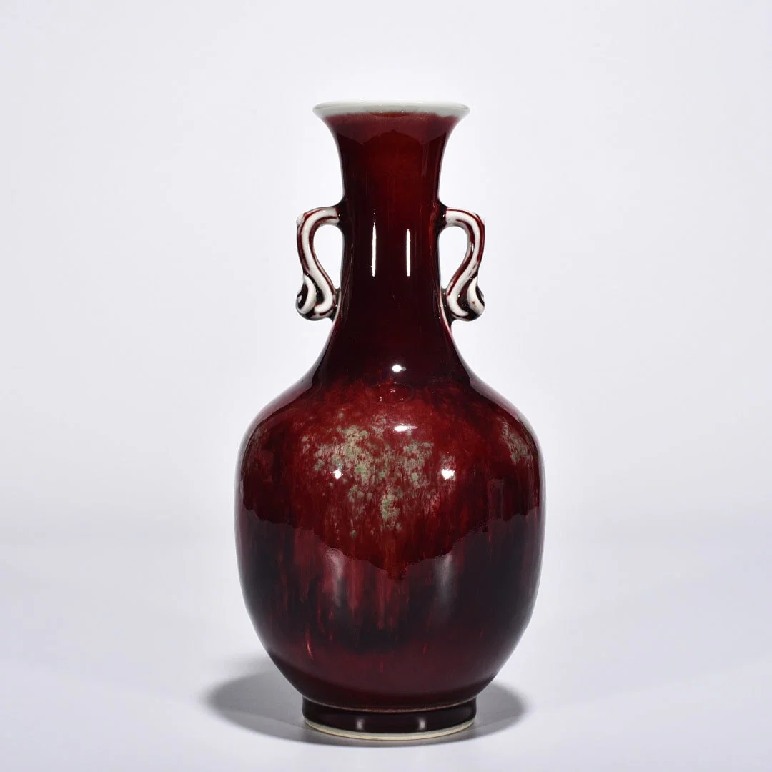 Qing Dynasty Kangxi cowpea red glaze beauty drunk Ruyi ear vase
