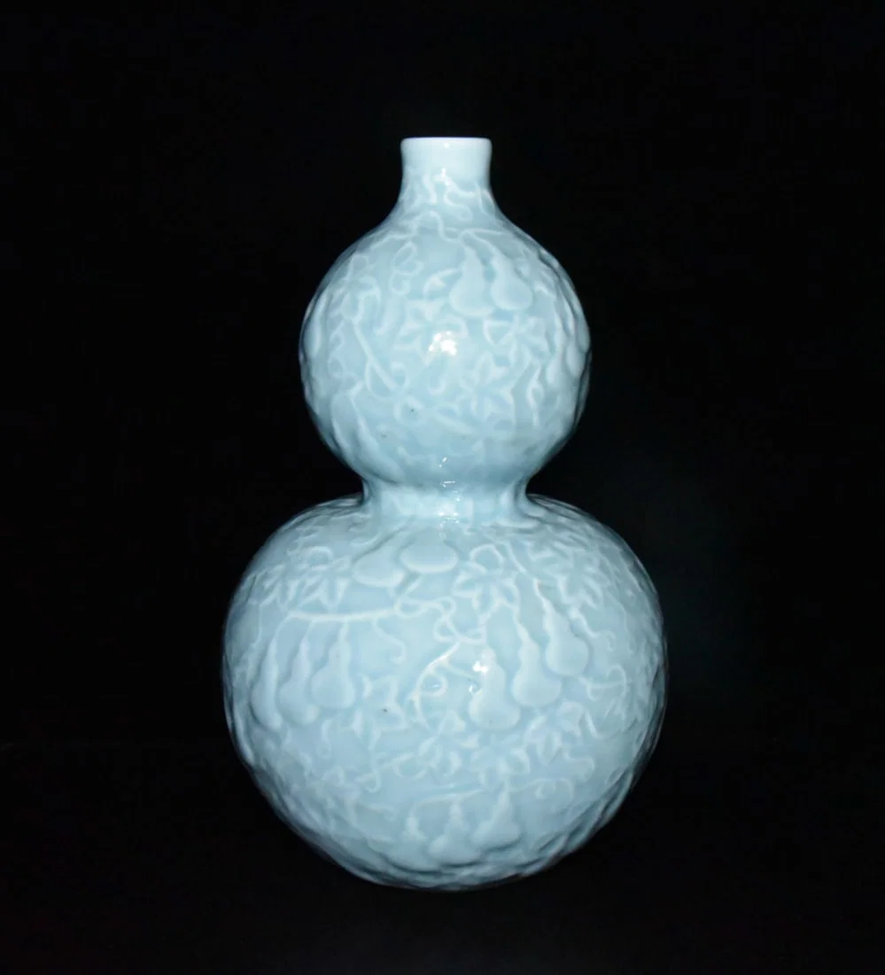 Qing Dynasty Qianlong period celadon glazed carved gourd-shaped bottle