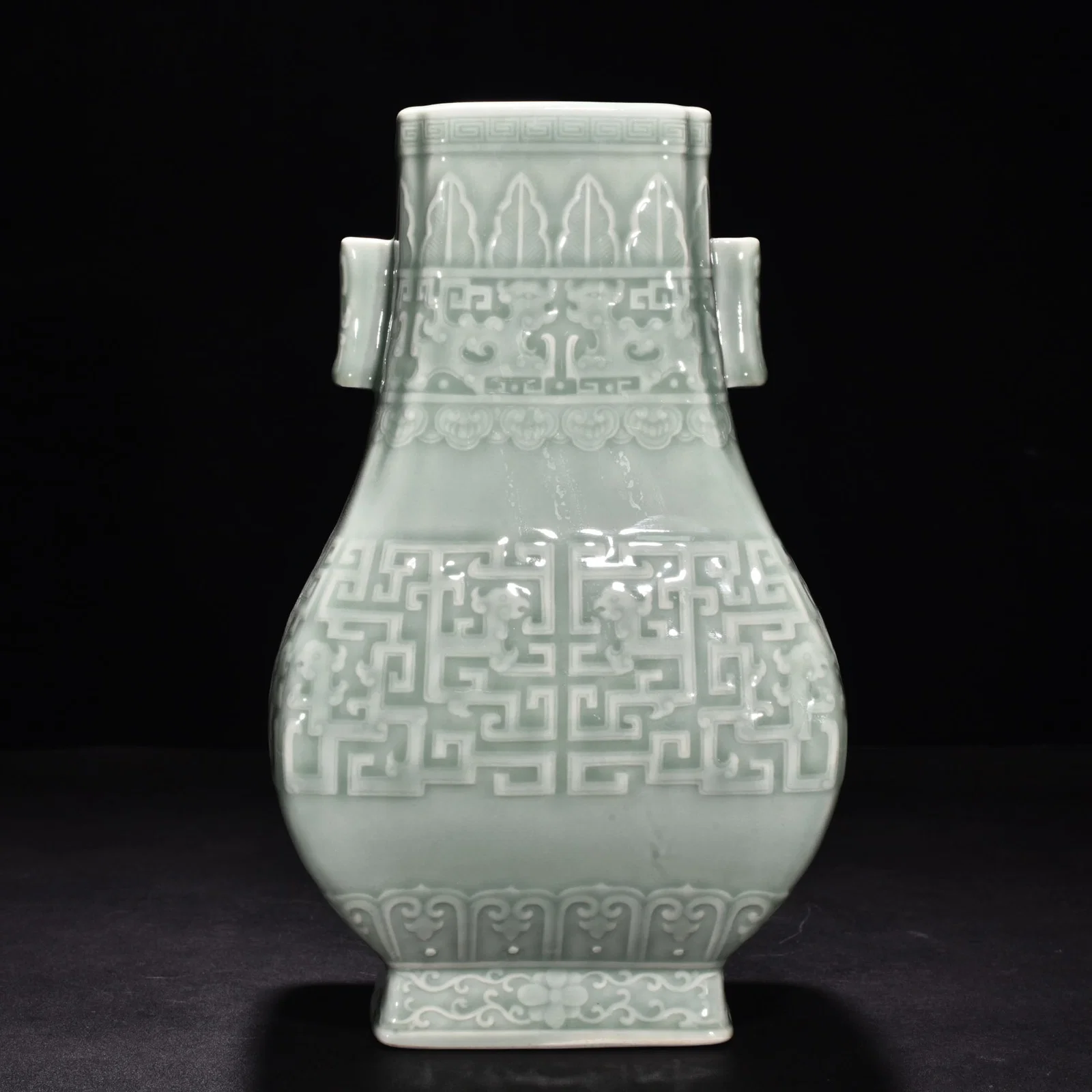 Qing Dynasty Qianlong pink celadon glaze carved Kui dragon through the ear vase